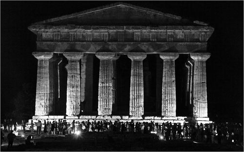 Group of people in front of historical building