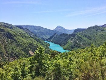 High angle view of trees and mountains against clear sky