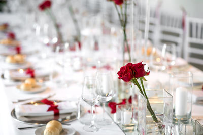 Close-up of red rose on table