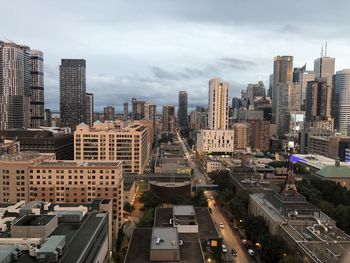 High angle view of buildings in city against sky