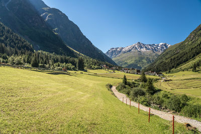 Scenic view of landscape and mountains against sky