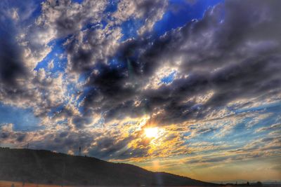 Low angle view of dramatic sky during sunset