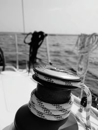 Close-up of drink on table against sea