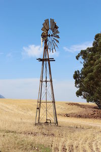 Traditional windmill on landscape