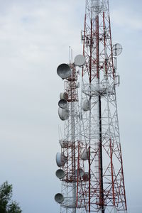 Low angle view of communications tower against sky