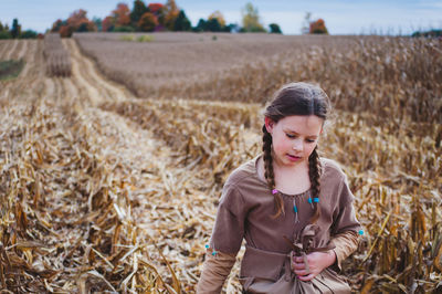 Girl standing on field