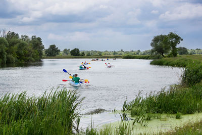 People kayaking in lake