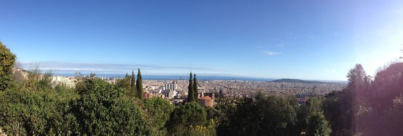 View of cityscape against blue sky