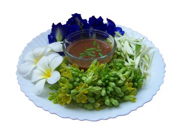 High angle view of fresh white flowers in plate