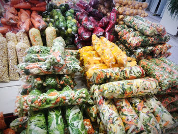 Stack of vegetables for sale at market stall