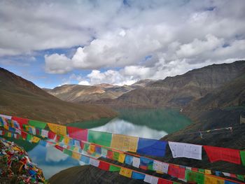 Scenic view of tibetan mountains and prayer flags against sky. 