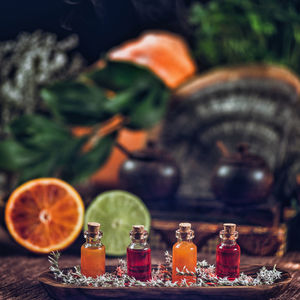 Close-up of essential oils in bottles on table