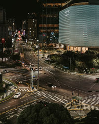 High angle view of illuminated buildings in city at night