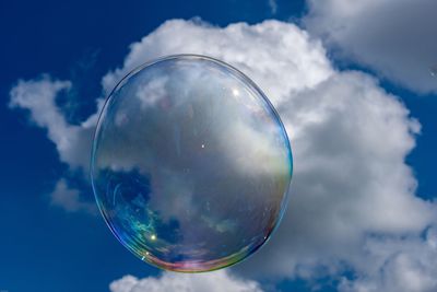 Low angle view of bubbles in sky