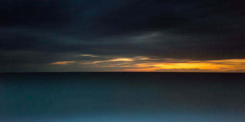 Scenic view of dramatic sky during sunset