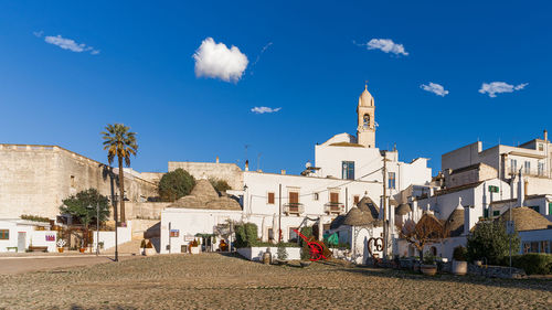 Buildings in city against sky