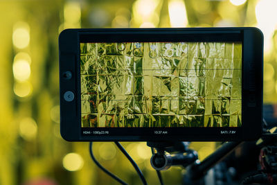 Camera filming monitor with abstract gold foil