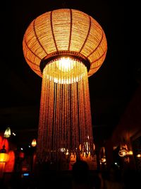 Low angle view of illuminated lanterns at night