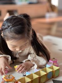 Close-up of girl playing with toy blocks