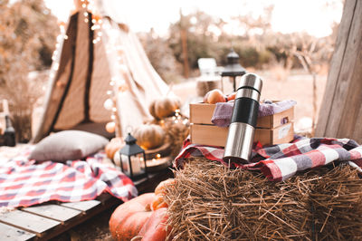 Autumn decorations. hot tea in thermos with ap