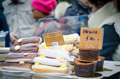 Close-up of chocolate desserts with labels at market stall