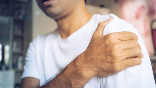 Close-up of man holding hands