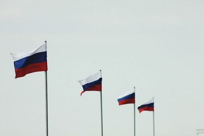 Red flag hanging on tree