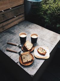 High angle view of coffee cups on table