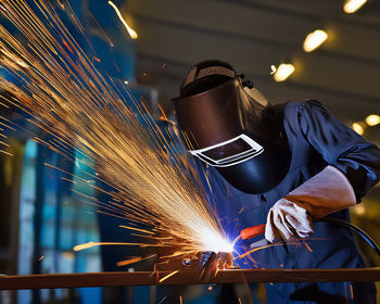 Welder with mask while working