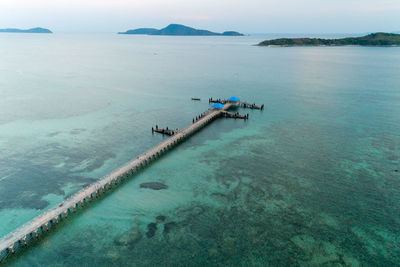 Aerial view of pier in sea