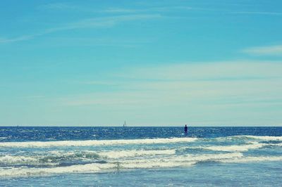 Scenic view of beach against cloudy sky