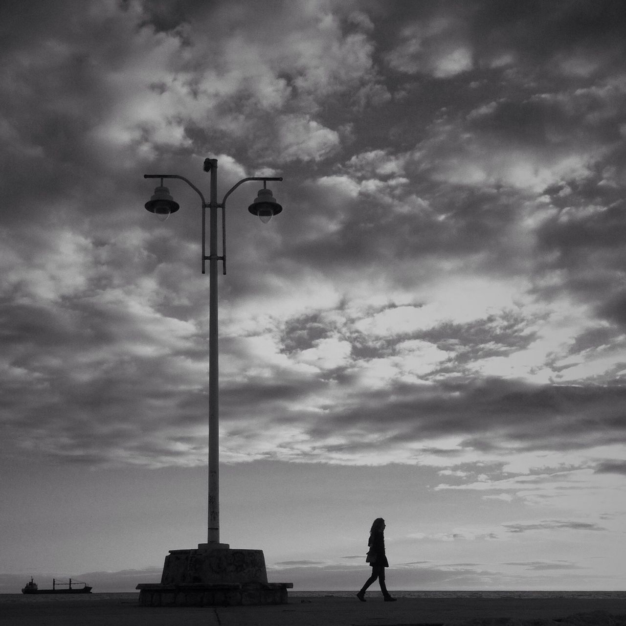 sky, silhouette, cloud - sky, standing, street light, men, sea, lifestyles, cloudy, leisure activity, cloud, horizon over water, full length, rear view, sunset, tranquility, nature, person