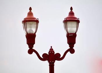 Low angle view of street light against sky