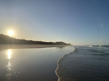 Scenic view of sea against clear sky during sunset