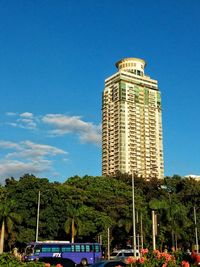 Low angle view of tower against blue sky