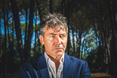 Portrait of a beautiful man with blue eyes. businessman is working outdoors in the park.