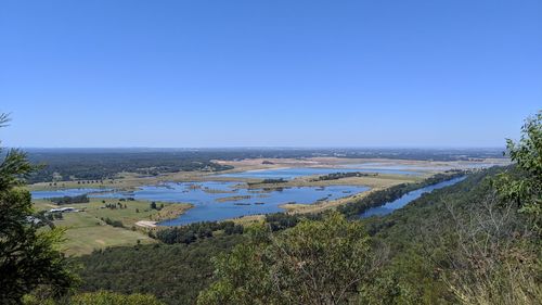 Scenic view of sea against clear blue sky