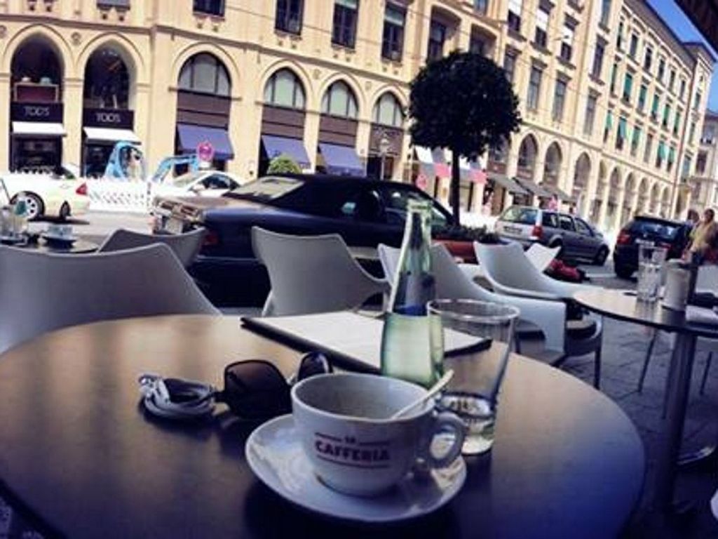 chair, table, architecture, building exterior, indoors, built structure, car, day, window, land vehicle, city, no people, restaurant, empty, absence, in a row, reflection, cafe, stationary, still life