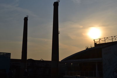 Low angle view of built structure at sunset