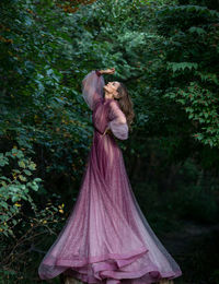 Low angle view of statue against trees