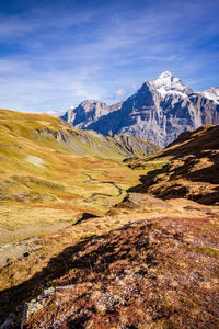 Scenic view of snowcapped mountains against sky