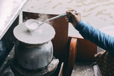 High angle view of man preparing food in kitchen