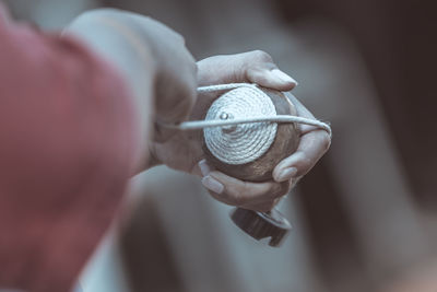 Close-up of woman holding yoyo