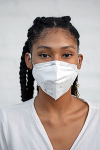 Young black woman in face mask