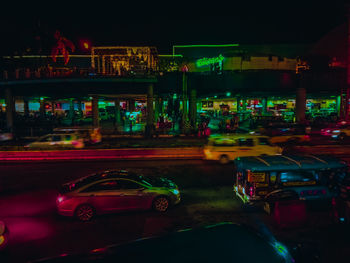 Cars on illuminated road at night