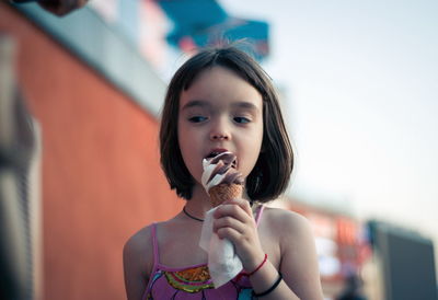 Portrait of girl eating food