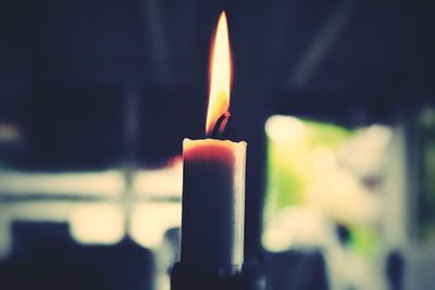 Close-up of lit candle