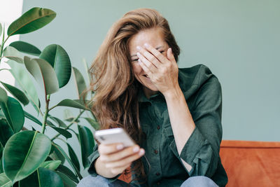 Young woman using mobile phone