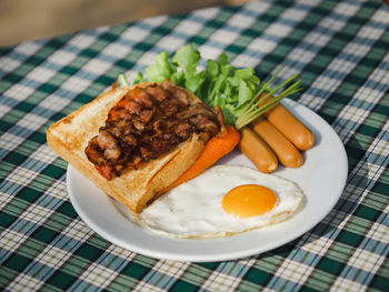 Close-up of food
breakfast bacon toasted bread , sausage ,eggs and vegetable  ,lunch time 