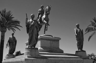 Low angle view of statue against sky